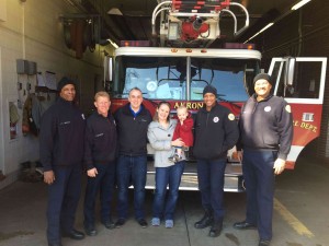 Volunteers with their daughter with the firefighters